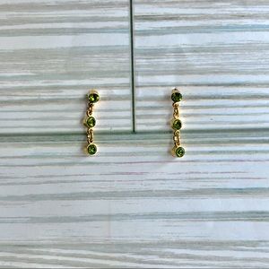 Peridot and gold tone pierced earrings